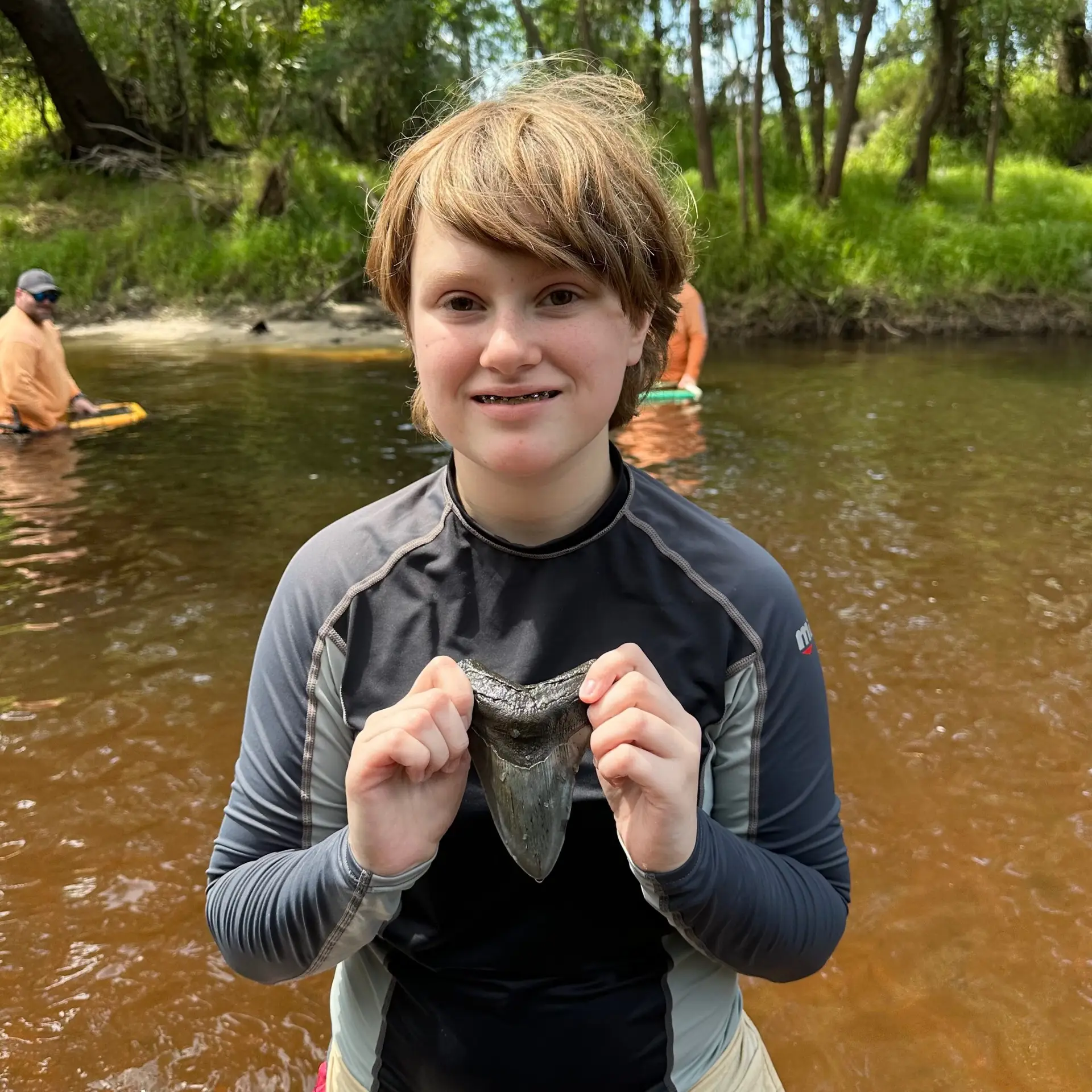 kids finding shark teeth Florida